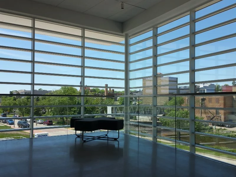 sitting area with windows and black chair