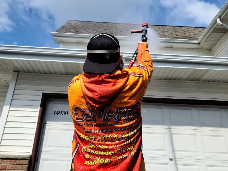 Demarks cleaning professional cleaning roof on white home