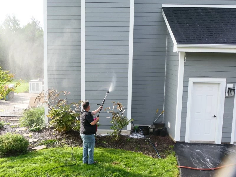 Pressure washing a house